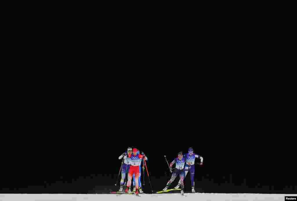 Nadine Faehndrich of Switzerland, Maiken Caspersen Falla of Norway, Victoria Carl of Germany, Anna Dyvik of Sweden, Katri Lylynpera of Finland and Lucia Scardoni of Italy compete during the women&#39;s sprint free quarterfinals at the 2022 Beijing Olympics in China.