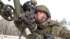 In this photo taken from video and released by the Russian Defense Ministry Press Service on Feb. 4, 2022, a soldier takes part in the Belarusian and Russian joint military drills at Brestsky firing range, Belarus.