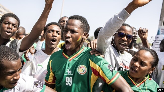 Supporters cheers ahead of the Senegalese football team's arrival in Dakar on Feb. 07, 2022, after winning, for the first time, the Africa Cup of Nation's.