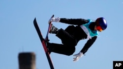 Eileen Gu, of China, competes during the women's freestyle skiing big air finals of the 2022 Winter Olympics, Feb. 8, 2022, in Beijing. 