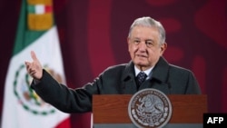 FILE - Mexican President Andres Manuel Lopez Obrador speaks during a press conference at the Palacio Nacional, in Mexico City, Jan. 17, 2022. On Feb. 7, 2022, Lopez Obrador denounced an upcoming auction of pre-Hispanic artifacts in France. (Handout photo)