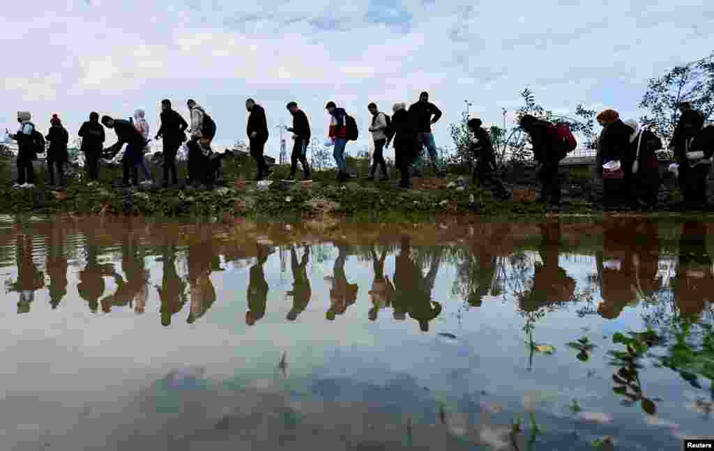 Palestinians visit Gaza Valley during a trip organized by the United Nations in central Gaza Strip, Feb. 6, 2022.