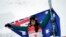 Australia's Jakara Anthony celebrates after winning a gold medal in the women's moguls finals at Genting Snow Park at the 2022 Winter Olympics, Feb. 6, 2022, in Zhangjiakou, China.