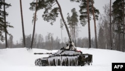 FILE - British soldiers take part in a major drill as part of the EFP NATO operation at the Tapa Estonian army camp near Rakvere, on Feb. 6, 2022.