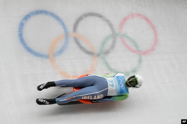 Elsa Desmond, of Ireland, slides during the luge women's singles run 1 at the 2022 Winter Olympics (AP Photo/Dmitri Lovetsky)