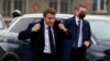 FILE - French President Emmanuel Macron gets ready to attend a function in Lievin, northern France, Feb. 2, 2022. Macron heads to Moscow this week for talks with Russian President Vladimir Putin.