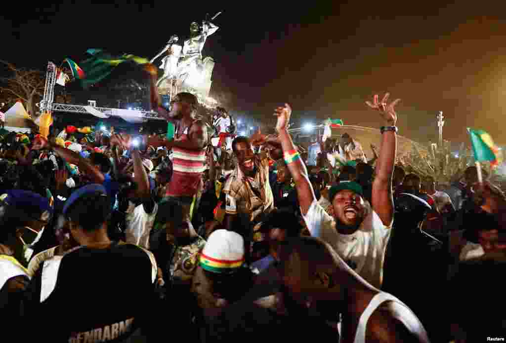 Senegal’s fans celebrate after winning the final game against Egypt in Dakar, Senegal, Feb. 6, 2022.