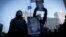Demonstrators hold photos of Amir Locke during a rally protesting his killing during a police raid, outside the Hennepin County Government Center in Minneapolis, Minnesota, Feb. 5, 2022. 