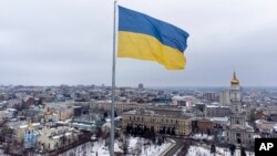 A Ukrainian national flag waves over the center of Kharkiv, Ukraine's second-largest city, Feb. 4, 2022. 