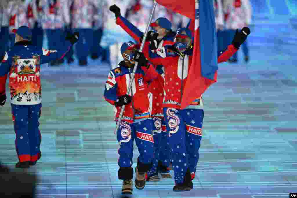 Haiti&#39;s flag bearer Richardson Viano leads the delegation during the opening ceremony of the Beijing 2022 Winter Olympic Games.