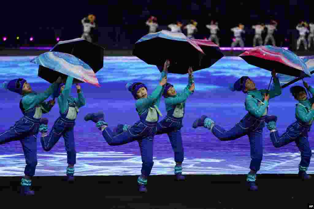 Dancers perform during the pre-show ahead of the opening ceremony of the 2022 Winter Olympics, Feb. 4, 2022, in Beijing.