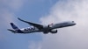 FILE - An Airbus A350-1000 flies during an aerial flying display ahead of the Singapore Airshow at Changi Exhibition Centre in Singapore, Feb. 18, 2024. 