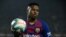 Ansu Fati tient le ballon lors d'un match entre le FC Barcelone et le Real Madrid, Espagne, le 18 décembre 2019.