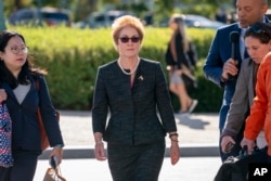 FILE - Former U.S. ambassador to Ukraine Marie Yovanovitch (C) arrives on Capitol Hill, in Washington, Oct. 11, 2019.