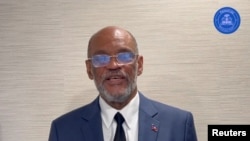 Haiti's Prime Minister Ariel Henry speaks while addressing the nation, at an unidentified location on a date given as March 11, 2024, in this screengrab obtained from a handout video. (Prime Minister of the Republic of Haiti via X)