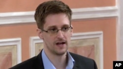 In this image made from video released by WikiLeaks on Friday, Oct. 11, 2013, former National Security Agency systems analyst Edward Snowden speaks during a presentation ceremony in Russia. 