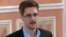 FILE - In this image made from video released by WikiLeaks, former National Security Agency systems analyst Edward Snowden speaks during a presentation ceremony in Russia. 