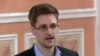 In this image released by WikiLeaks Oct. 11, 2013, former National Security Agency systems analyst Edward Snowden speaks during a presentation ceremony in Russia. 