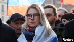 FILE - Russian opposition figure Lyubov Sobol takes part in a rally to mark the 5th anniversary of opposition politician Boris Nemtsov's murder and to protest against proposed amendments to the country's constitution, in Moscow, Feb. 29, 2020. 