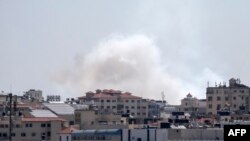 A picture taken from the Gaza Strip, May 4, 2019, shows smoke billowing after missiles were launched toward Israel.