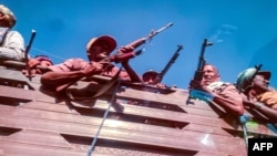 A picture taken from a car shows Ethiopian Amhara militia soldiers, who fight alongside federal and regional forces against the northern region of Tigray, in the city of Gondar, Ethiopia, on November 9, 2020.