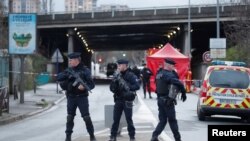 French police secure an area in Villejuif near Paris, France, after police shot dead a man who tried to stab several people in a public park, Jan. 3, 2020.