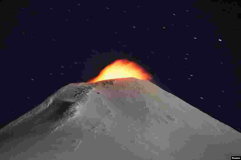 The Villarrica Volcano is seen at night from Pucon town, Chile.