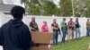 Armed Bystanders Watch Floyd Protesters March in Indiana