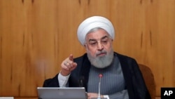 President Hassan Rouhani, seen in this July 3, 2019 photo, warned European partners in its faltering nuclear deal on Wednesday that Tehran will increase its enrichment of uranium to "any amount that we want." 