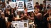 Victoria Moyano Artigas, left, and Pablo Diaz, right, along with relatives of those who suffered abuse during Argentina's military dictatorship celebrate as 12 defendants are sentenced for crimes against humanity in La Plata, Buenos Aires Province, Argentina, on March 26, 2024. 