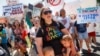 Demonstrators chant as they protest the arrival of President Donald Trump outside Miami Valley Hospital after a mass shooting that occurred in the Oregon District early Sunday morning, Aug. 7, 2019, in Dayton, Ohio.