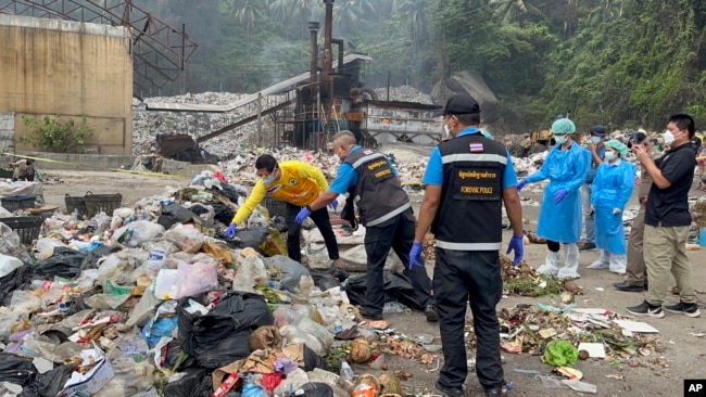 FILE - Thai police forensic officers investigate a garbage dump as they search for parts of the body of Colombian surgeon Edwin Arrieta Arteaga on Koh Pha-ngan island, Thailand, on Aug. 4, 2023.