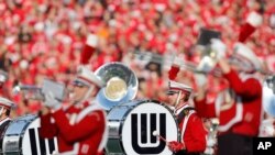 FILE - The University of Wisconsin-Madison marching band plays before a college football game in Madison, Wis., Nov. 17, 2012.