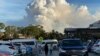 FILE - This May 2, 2021, photo shows smoke filling the sky as Sydney is enveloped in a thick bank of hazardous bushfire smoke, forcing authorities in Australia's largest city to scale back controlled forest burning nearby. 