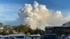 FILE - This May 2, 2021, photo shows smoke filling the sky as Sydney is enveloped in a thick bank of hazardous bushfire smoke, forcing authorities in Australia's largest city to scale back controlled forest burning nearby. 