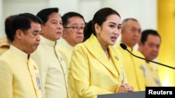 Thai Prime Minister Paetongtarn Shinawatra, backed by members of her Cabinet, speaks during a press conference in Bangkok, Thailand, on Sept. 7, 2024.