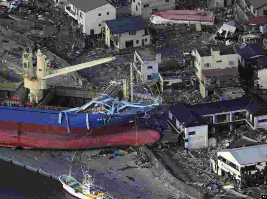 A ship is swept by waves after a tsunami and earthquake in Kamaishi City in Iwate Prefecture March 12, 2011. Japan confronted devastation along its northeastern coast on Saturday, with fires raging and parts of some cities under water after a massive eart