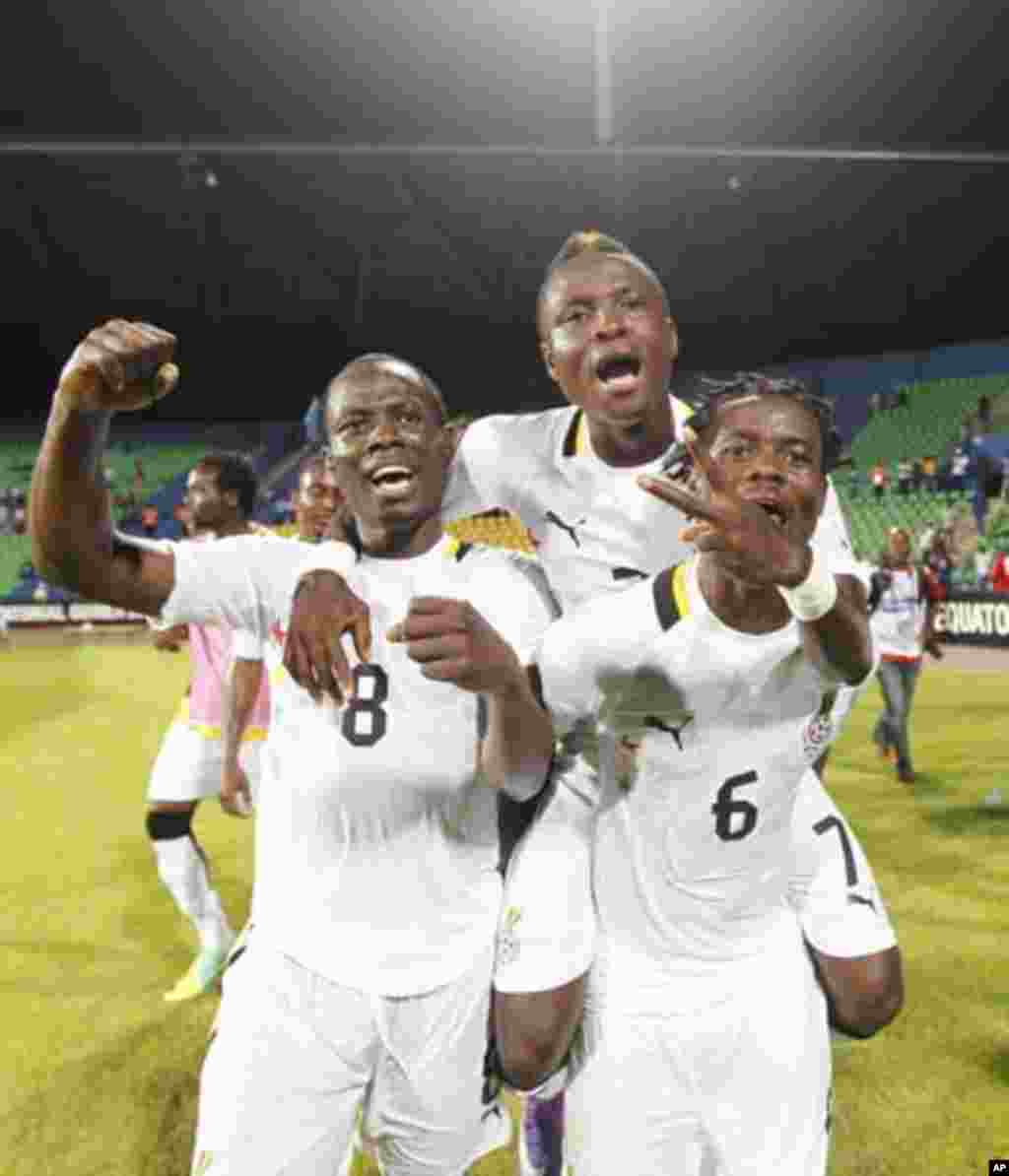 Ghana's Anthony Annan (6), Emmanuel Agyemang-Badu (8) and Samuel Inkoom (7) celebrate after beating Mali in their African Nations Cup Group D soccer match at Franceville Stadium January 28, 2012.