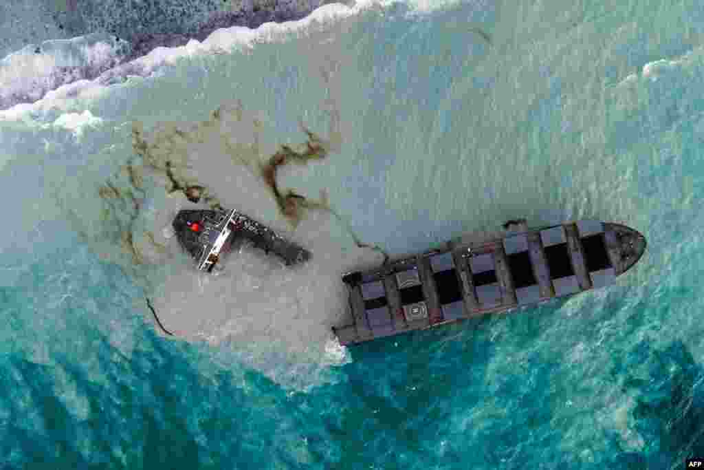 This aerial picture shows the MV Wakashio bulk carrier that had run aground and near Blue Bay Marine Park, Mauritius, splits into two.