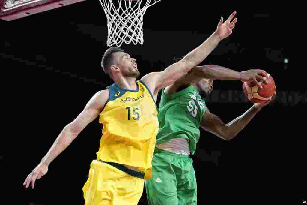 Nigeria&#39;s Precious Achiuwa grabs a rebound ahead of Australia&#39;s Nic Kay (15) during a men&#39;s basketball preliminary round game at the 2020 Summer Olympics, Sunday, July 25, 2021, in Saitama, Japan. (AP Photo/Charlie Neibergall)