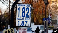 Gas prices are displayed at a service station in Leonia, N.J., Tuesday, Nov. 24, 2015. With Thanksgiving gas prices falling, the number of travelers is expected to rise, with one traffic-tracking firm predicting delays could be noticeably longer than last year. (AP Photo/Seth Wenig)