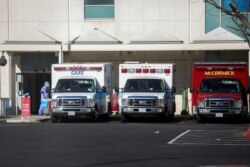 Ambulances are seen outside of St. Francis Medical Center emergency room during a surge of coronavirus disease (COVID-19) cases in Los Angeles, California, Dec. 26, 2020.