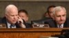 Senate Armed Services Committee Chairman John McCain, R-Ariz., left, accompanied by the committee's ranking member, Sen. Jack Reed, D-R.I., speaks during a committee meeting on Islamic State, on Capitol Hill in Washington, Oct. 27, 2015. 