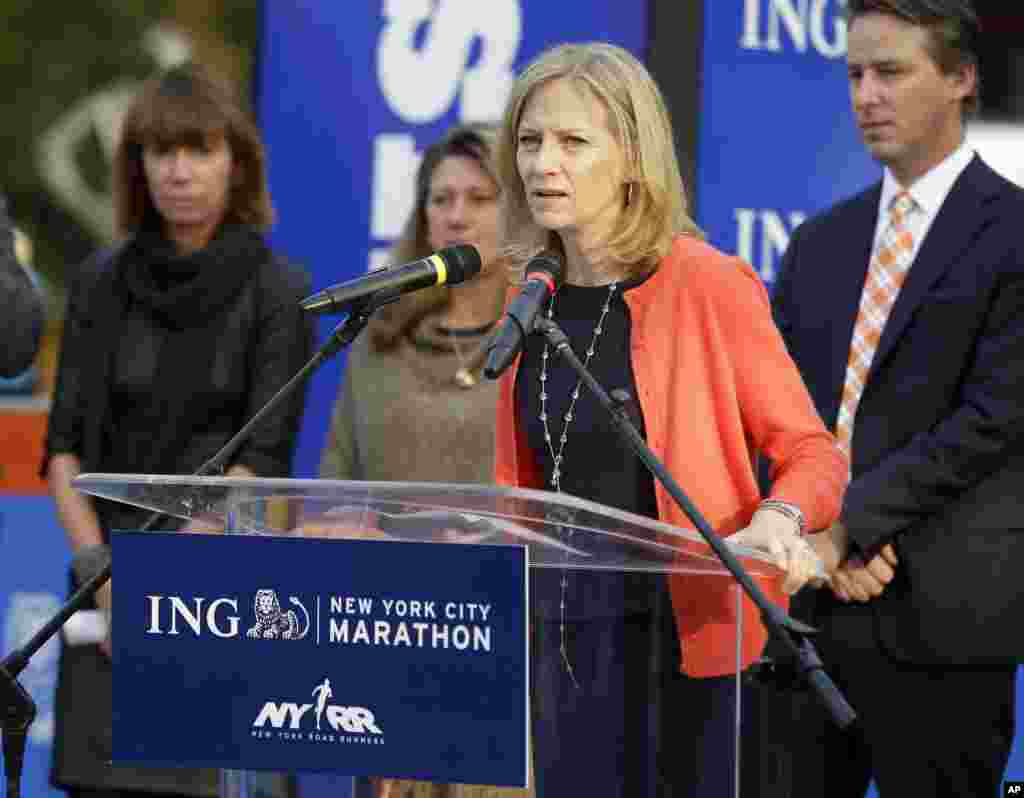 New York Road Runners President and CEO Mary Wittenberg speaks to reporters during a news conference at the finish line of the NYC Marathon in New York, Oct. 30, 2013. 