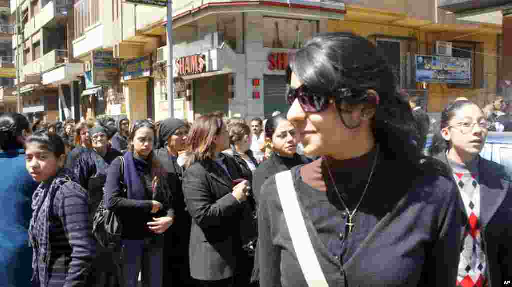 A young Christian woman waits in line to enter the cathedral. (VOA-E. Arrott)