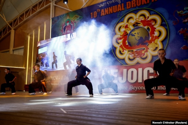 Kung Fu nuns, who practice the martial art for self-defense and meditation, demonstrate their skills at Druk Amitabha Mountain Nunnery in Kathmandu, Nepal December 30, 2024.