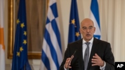 Greek Foreign Minister Nikos Dendias speaks during a news conference in Athens, Oct. 27, 2020.
