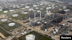 FILE - A petrochemical plant is shown in this aerial view after Hurricane Ike moved through the area in Port Arthur, Texas, Sept. 14, 2008.
