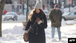 A woman walks down the street in the Back Bay a day after a winter storm in Boston, Massachusetts, Jan. 4, 2013.