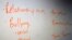 FILE - The board in a classroom is shown with key words during a Youth Aware of Mental Health session at Uplift Hampton Preparatory School in Dallas, Nov. 15, 2018.